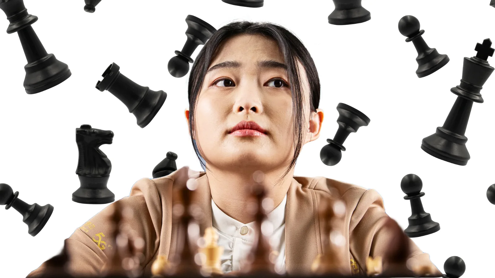 GM Ju Wenjun with the chess pieces